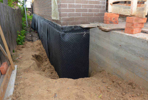 SJ Waterproofing Pros technician performing targeted Emergency Waterproofing assessment in Irvington, AL